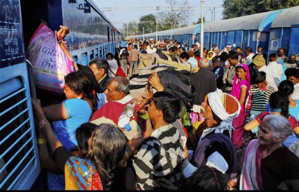 Devotees trying to board a train ahead of Maha Shivratri in Varanasi. (PTI)